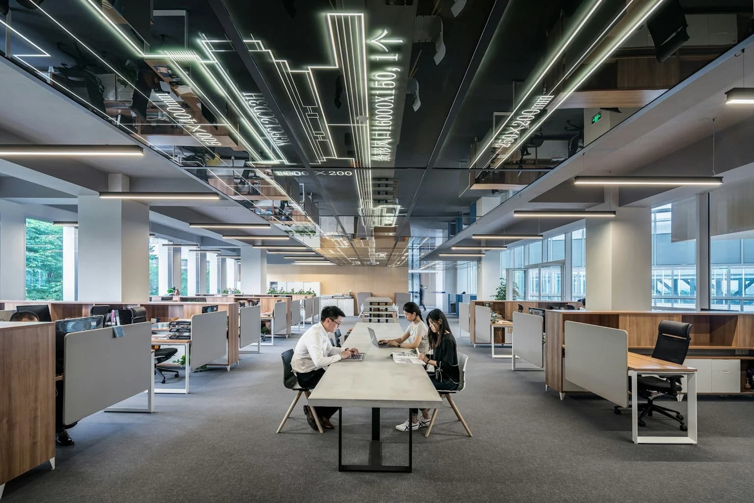 Stock photograph of people at a long office table